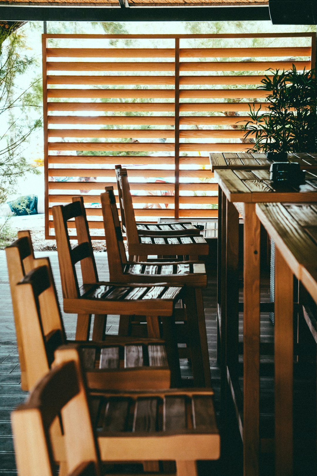 Dining area with a white dining bench with back and a wooden dining table