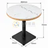 Round quartz restaurant table with white veined top, wood veneer edge and black square pedestal base