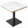 Top view of square quartz café tabletop showing gray veining and rounded corners