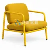Close-up of yellow upholstered seat cushion and broad padded backrest on commercial lounge chair